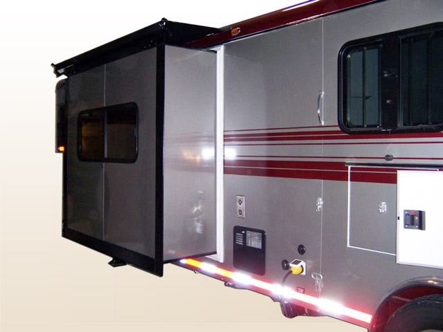 A Double D Trailers horse trailer with a slide out living quarters. 