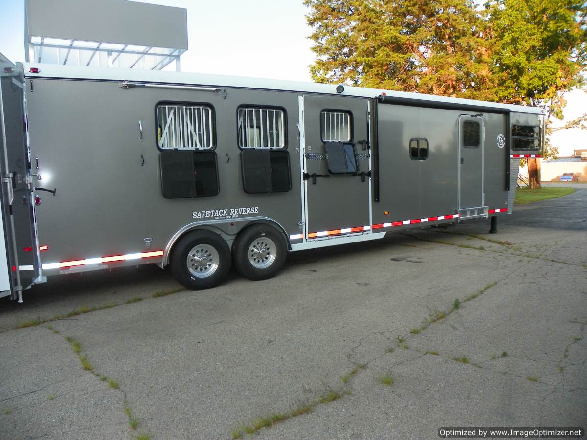 Double D Trailers SafeTack Reverse living quarters horse trailer parked at the factory. 
