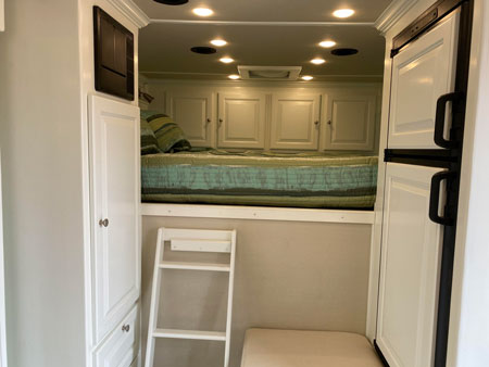 Sleeping area in a custom living quarters horse trailer by Double D Trailers 