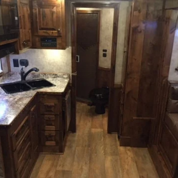 A well-organized living quarters horse trailer interior from Double D Trailers. 