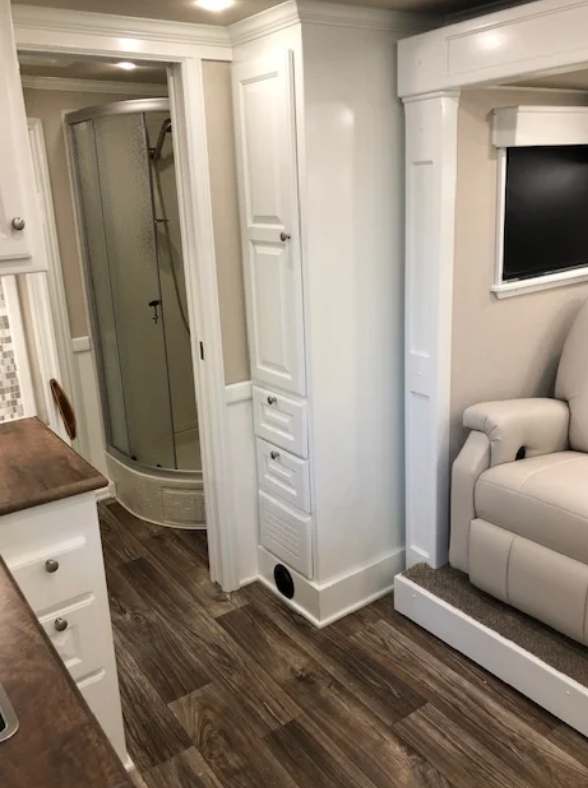 Slim cabinets inside of a Double D Trailers living quarters horse trailer help to save space. 