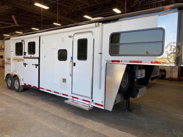 A Double D Trailers Living Quarters Horse Trailer inside of the factory. 