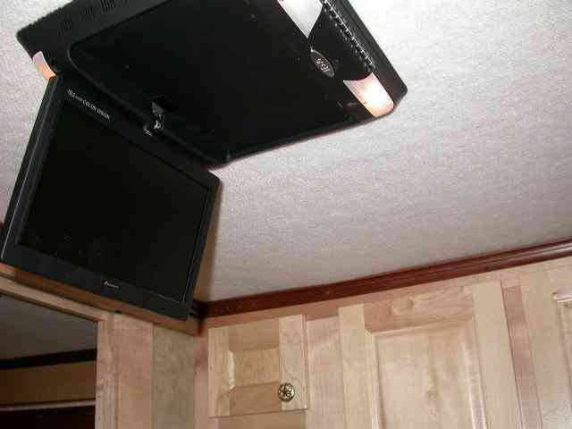 Swivel arm television bracket for living quarters horse trailer. 