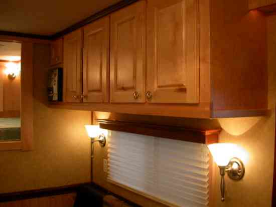 Ceiling mounted cabinets inside of a Double D Trailers living quarters horse trailer. 
