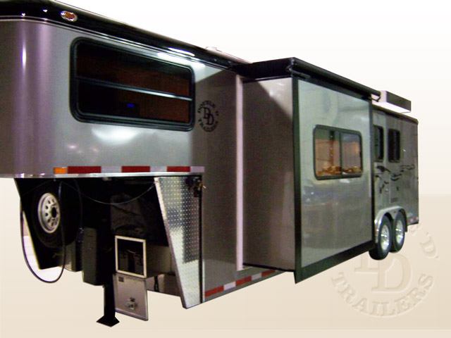 A living quarters horse trailer with a slide-out. 