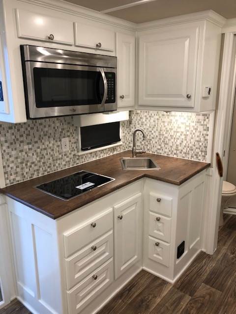 Upgrade your interior cabinets and moldings to all hardwood in place of Vinyl Wrapped.  Priced per short wall foot of your interior. (Example: 7' short wall you would select 7).