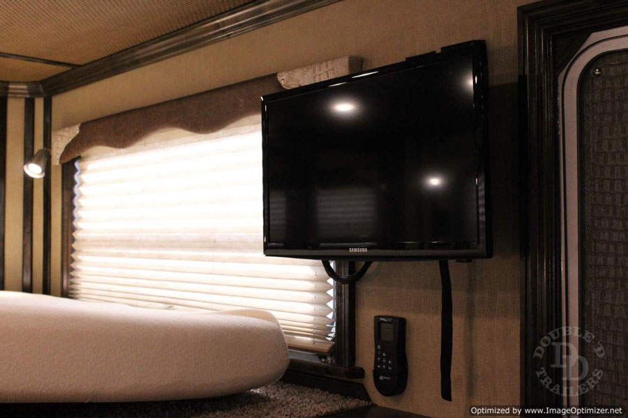 A flat screen TV inside a Double D Trailers living quarters horse trailer. 