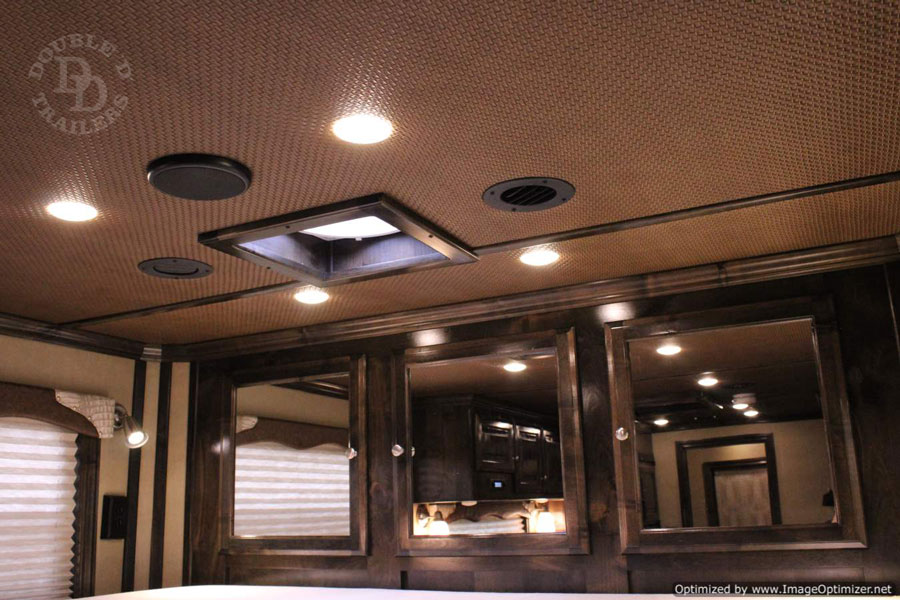 Flush mounted lighting inside of a living quarters horse trailer from Double D Trailers. 