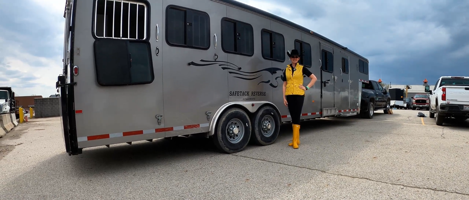 An owner standing beside her Double D SafeTack Reverse gooseneck trailer