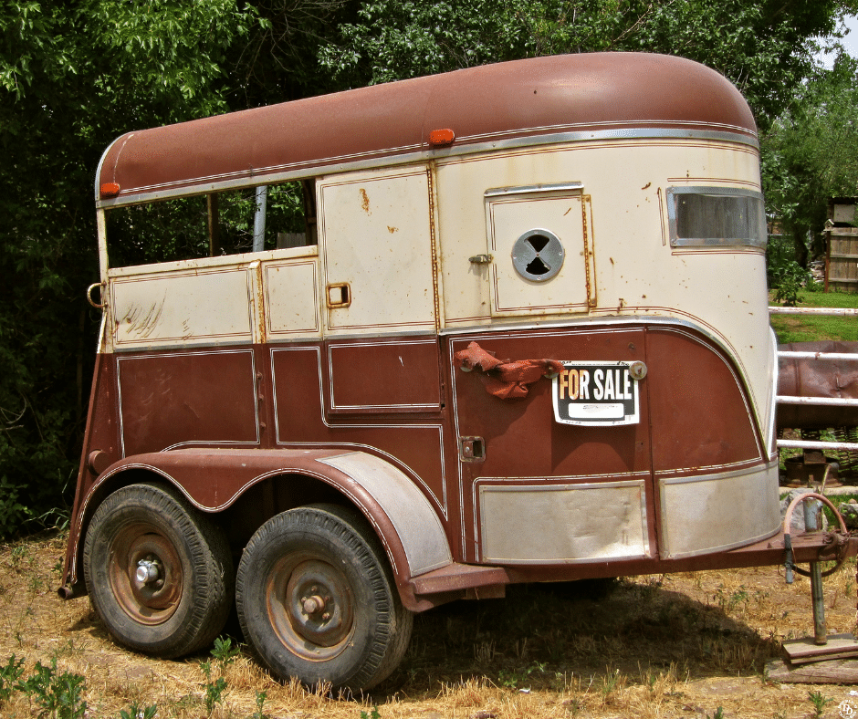 An old bumper pull horse trailer with rust 