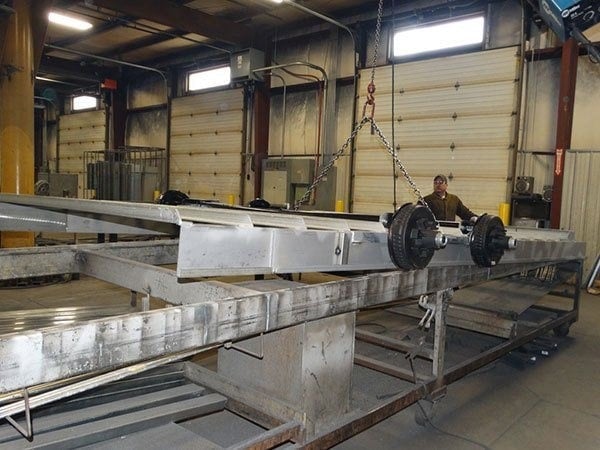 A Double D Trailer being constructed inside of the factory. 