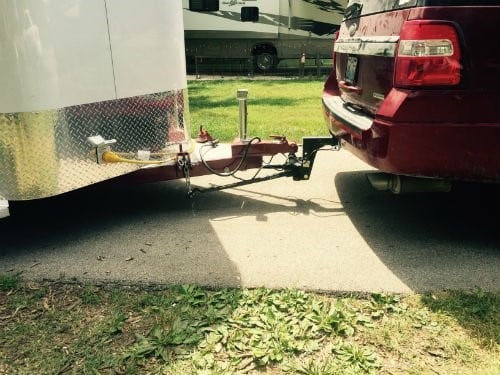 A tow vehicle hitched up to a trailer. 