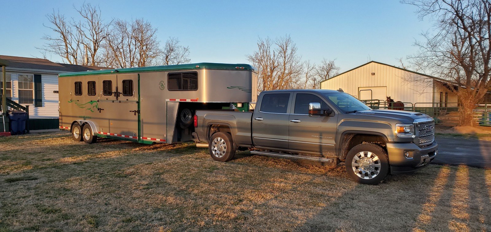 A Double D Trailers gooseneck model hitched to a tow vehicle. 