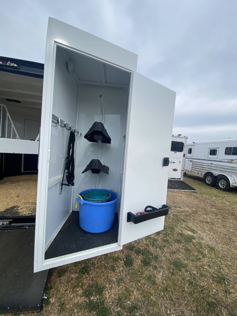 Bucket for watering a horse inside of a SafeTack storage compartment 