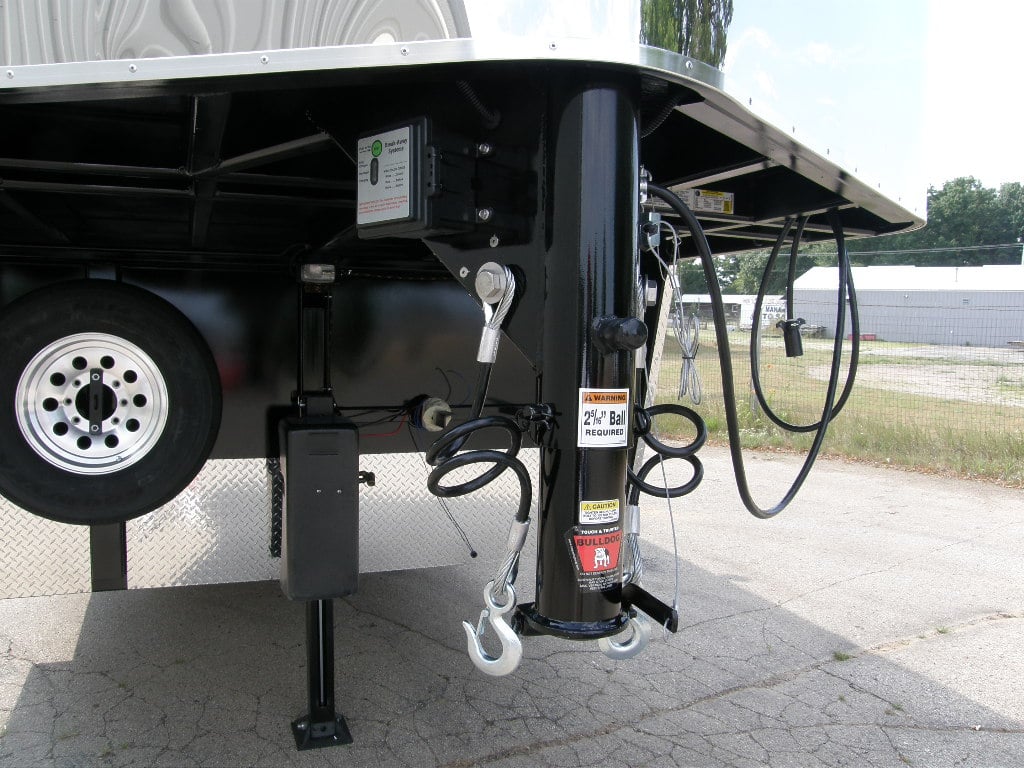 Hydraulic jack on the front of a gooseneck horse trailer.
