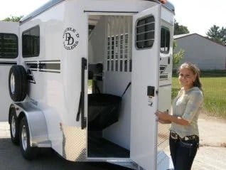 A happy Double D Trailers owner with her new bumper pull trailer.