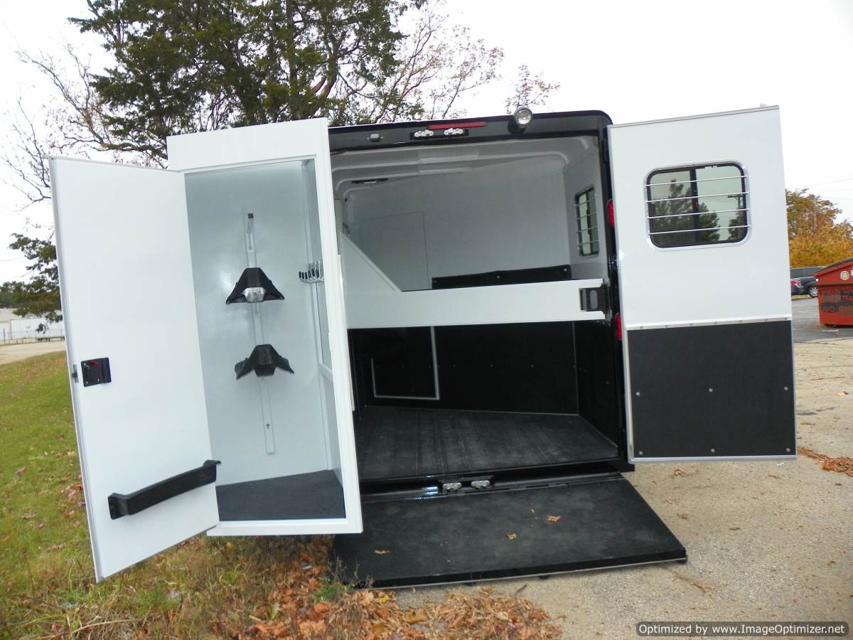 a rear view of a Double D Trailer showing the patented swing out SafeTack compartment 