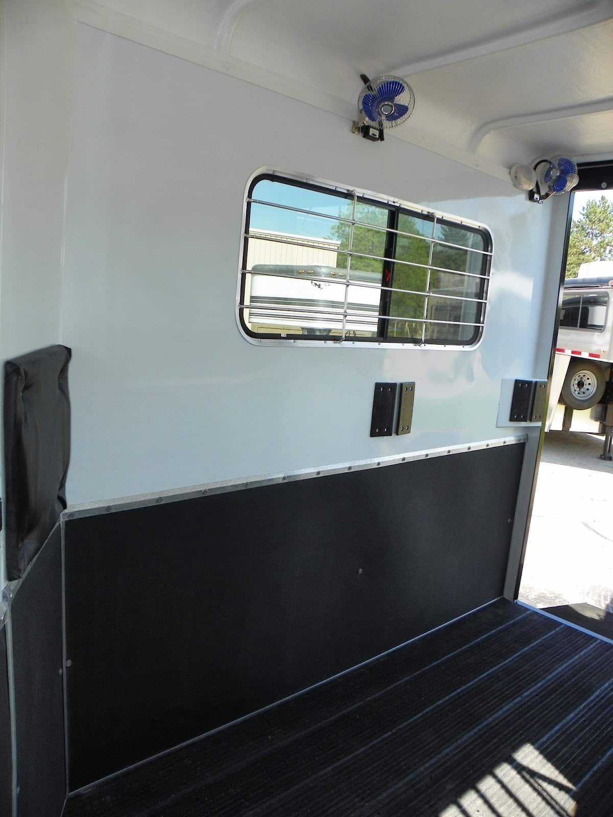 Double D Trailers SafeKick Wall System helps to keep horses safe in the event of kicking or pawing during travel.