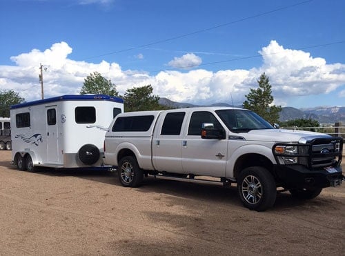 A Double D Trailers Bumper Pull model attached to a tow vehicle.