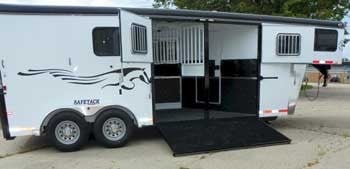 A Double D SafeTack Reverse Horse Trailer with a side ramp