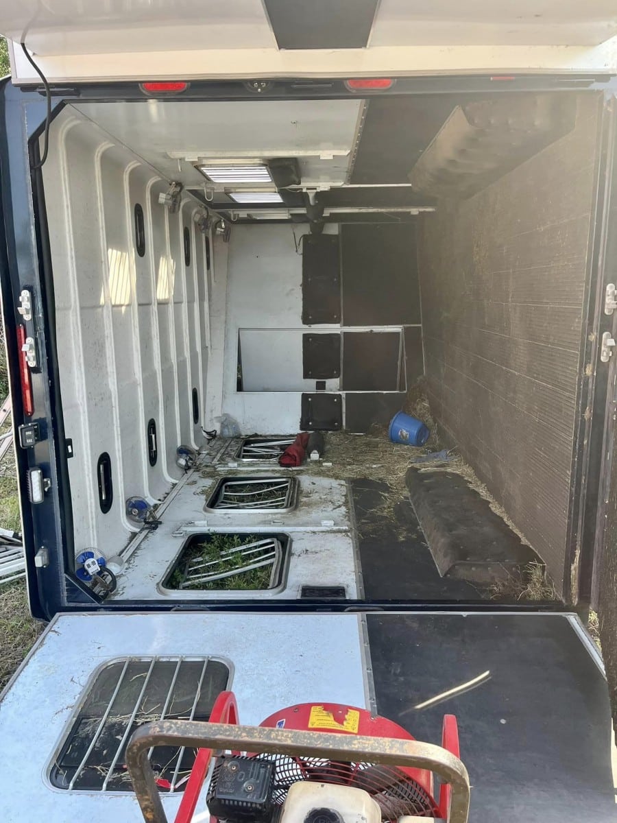 Overturned horse trailer after a horse trailer accident.