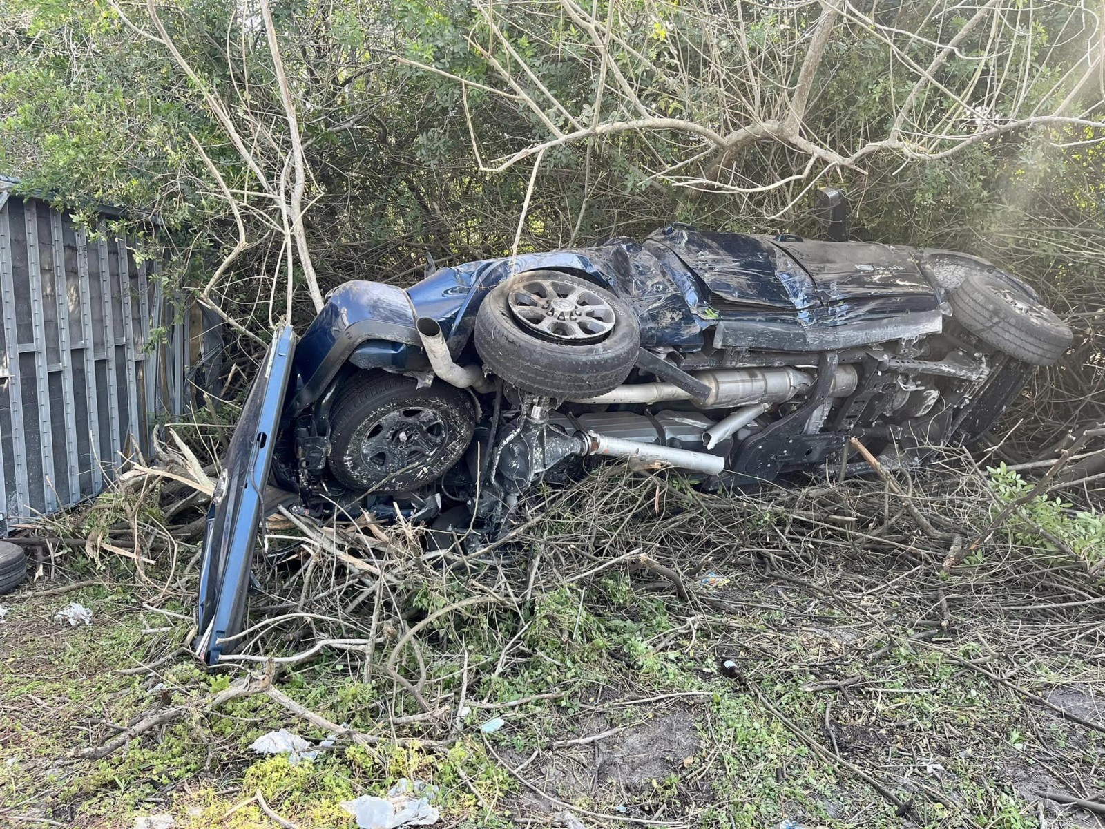 A totaled truck after a horse trailer accident. 