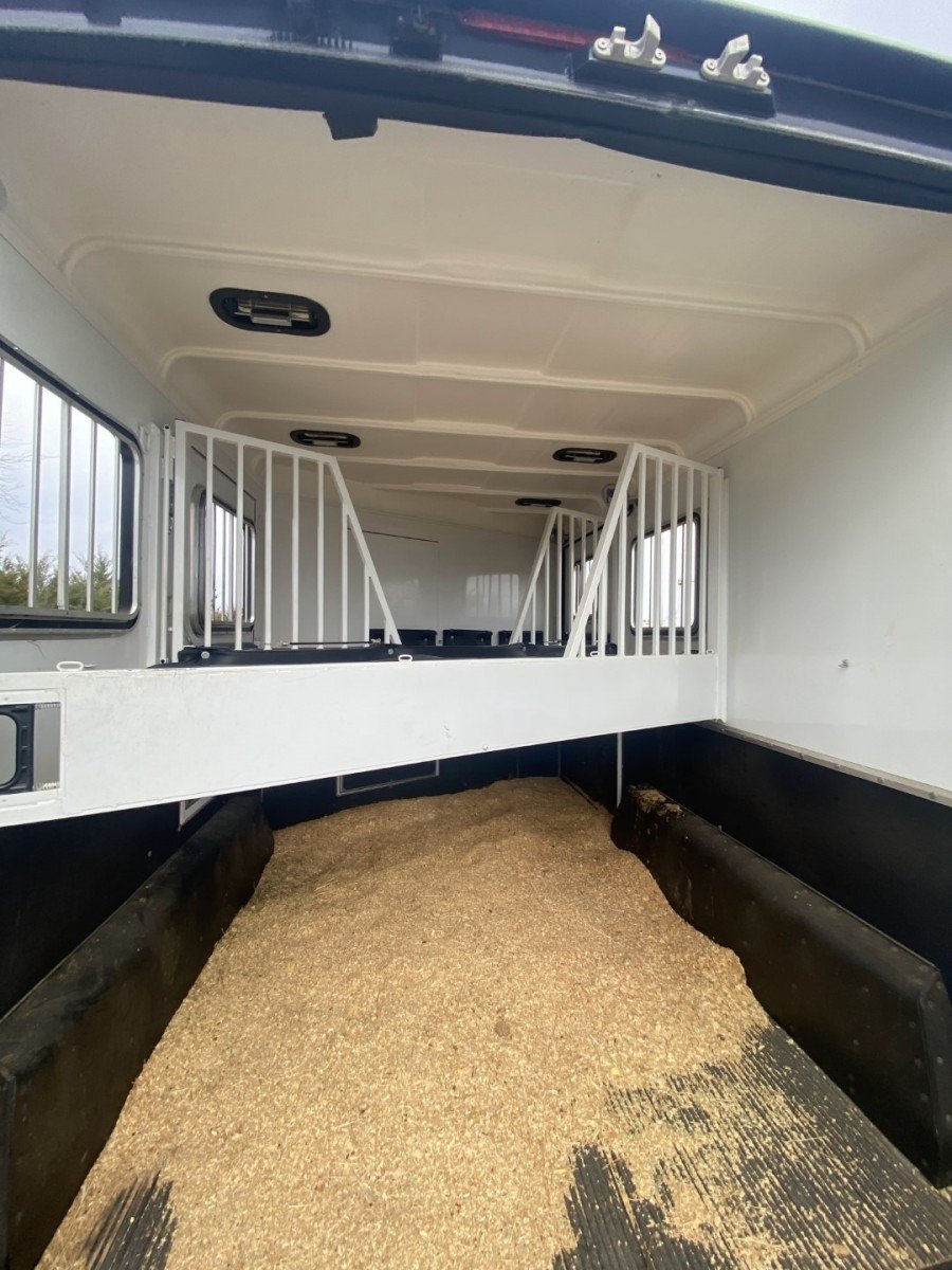 bedding inside of a stall area of a horse trailer 
