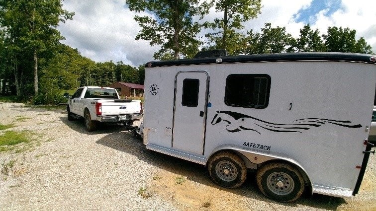 Double D's SafeTack one horse bumper pull trailer with living quarters being towed by a truck