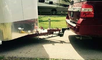 Bumper pull horse trailer hitched to tow vehicle