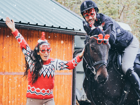 a family christmas picture with a horse 
