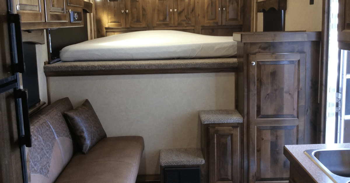 An interior view of a custom horse trailer with living quarters from Double D Trailers. 