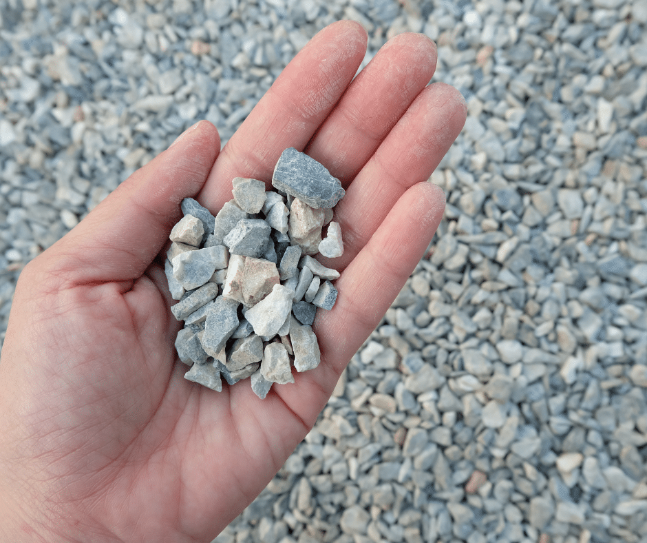 a photo of someone holding gravel inside the palm of their hand