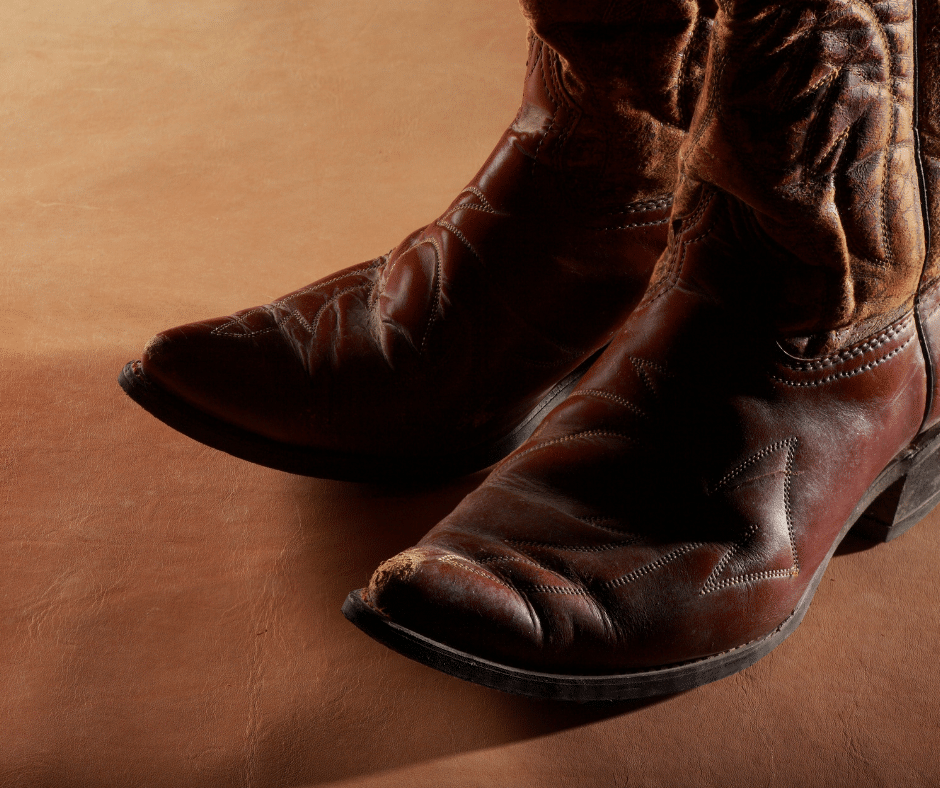 a close up picture of brown leather cowboy boots