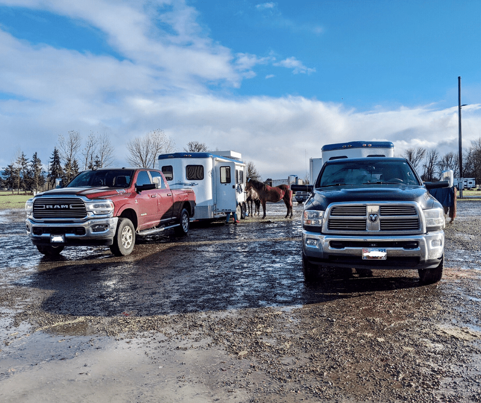 two bumper pull trailers hitched up to trucks beside each other