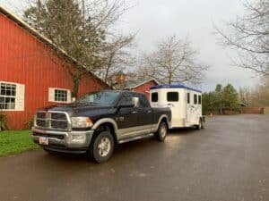 Double D Trailers SafeTack Reverse 2 Horse Bumper Pull Trailer hitched to a Dodge truck.