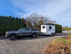 Double D Trailers client photo of a Bumper Pull model hitched to a tow truck.