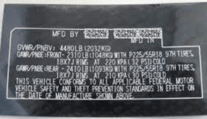  Plaque indicating vehicle compliance with FMVSS standards. 