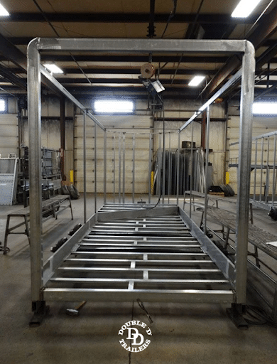 Double D Trailer being built inside of the factory - in the framing stage.