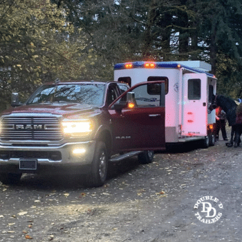 A Double D Trailers bumper pull model being towed.