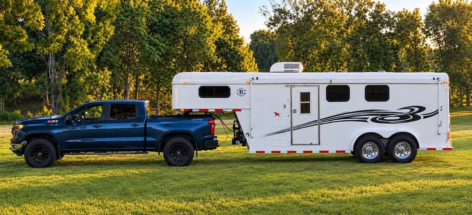 2006 Double D Trailers gooseneck horse trailer hitched to a pickup
