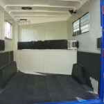 Horse area interior with SafeKick walls in Double D 2-horse gooseneck trailer
