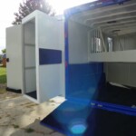 SafeTack swing-out tack compartment open on Double D 2-horse gooseneck trailer